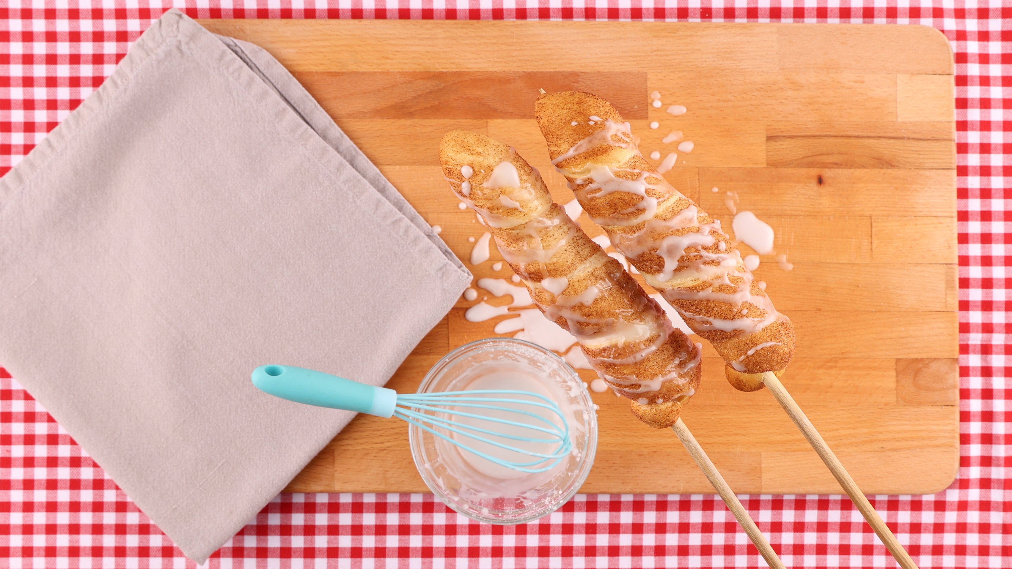 Two cinnamon twists on sticks